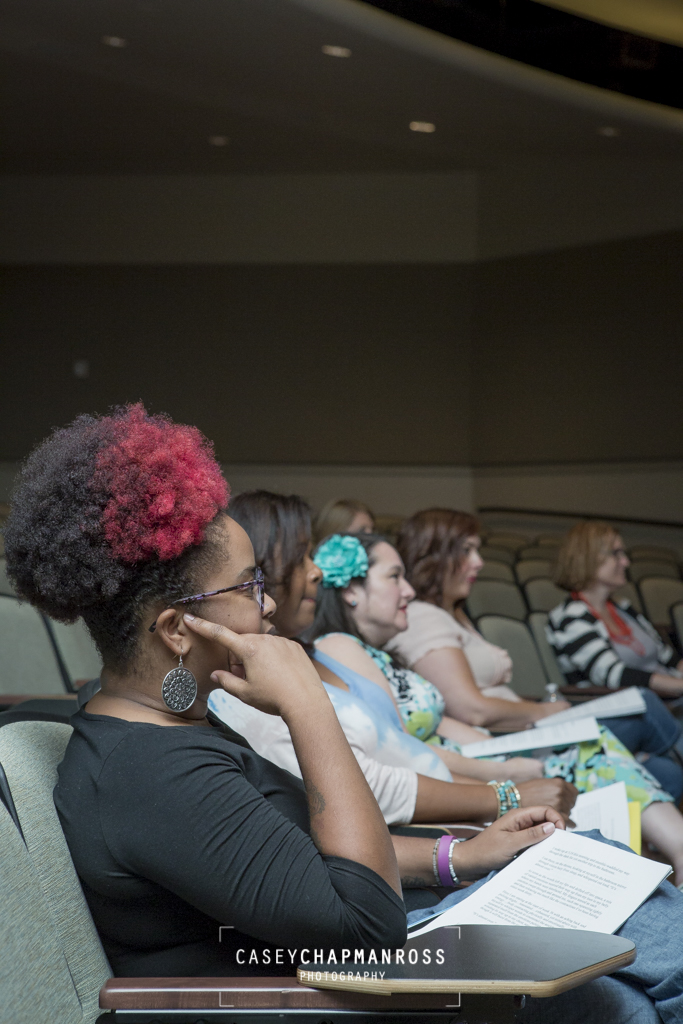women listening in an auditorium