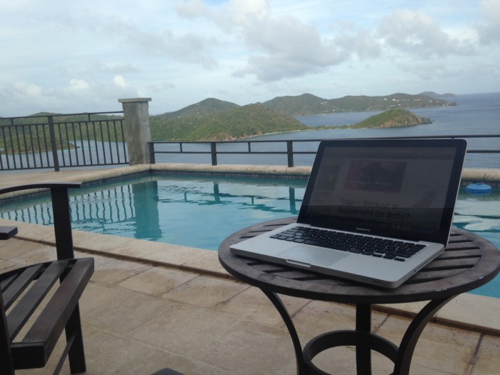 Laptop in front of pool and the islands of St. John USVI