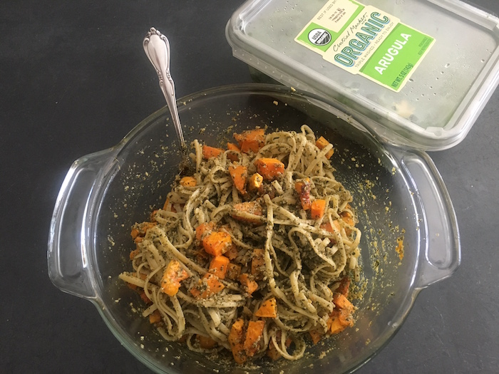 Gluten free pasta with roasted butternut squash and pesto with arugula.