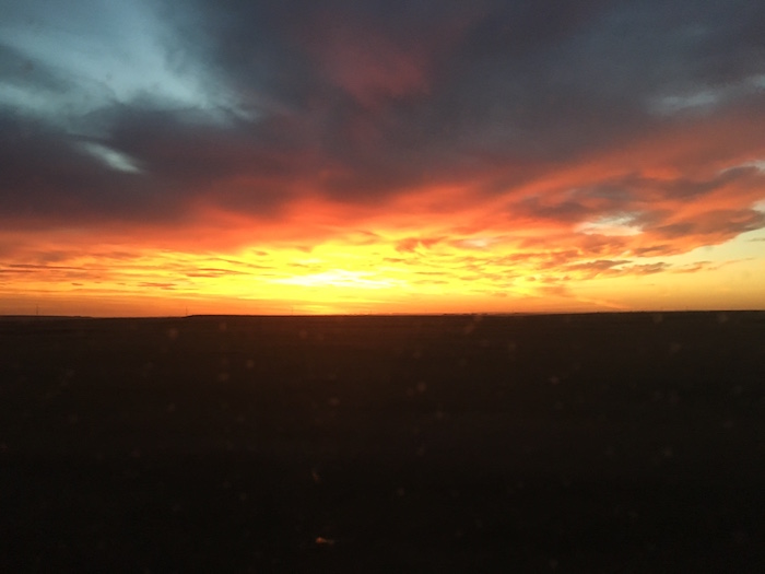 Dramatic orange and yellow sunrise in northwestern Nebraska.