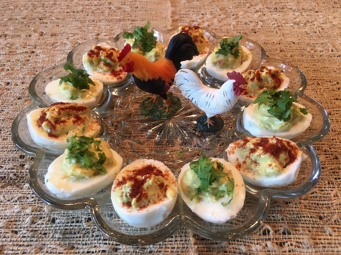 Deviled egg plate with toy chickens in the center