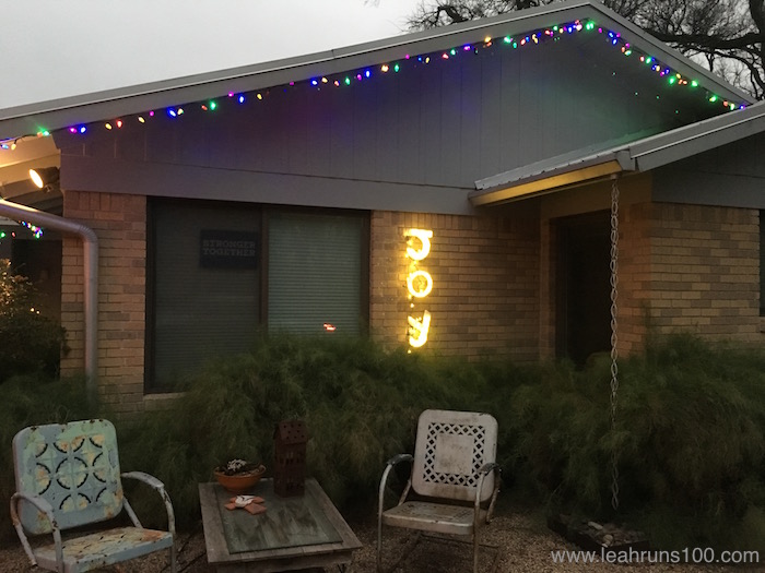 House in Austin with Christmas lights on eaves and "JOY" letters.