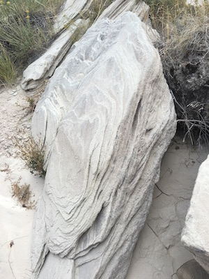 Rippled, slanted rocks created by earthquake and fault movement on the trail to Toadstool Geologic Park