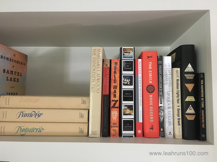 Shelf with copies of The Handmaid's Tale by Margaret Atwood and other books.